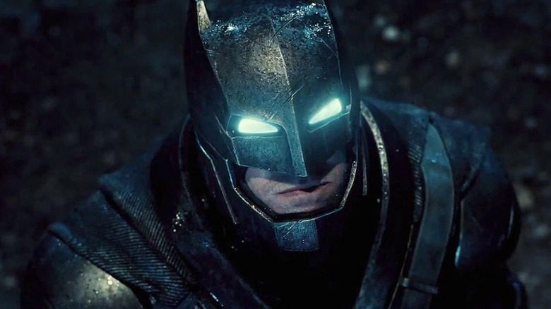 Batman (Ben Affleck) suits up to fight Superman