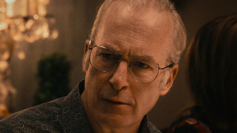 Bob Odenkirk as Lee Lane, scowling at the dinner table in The Bear