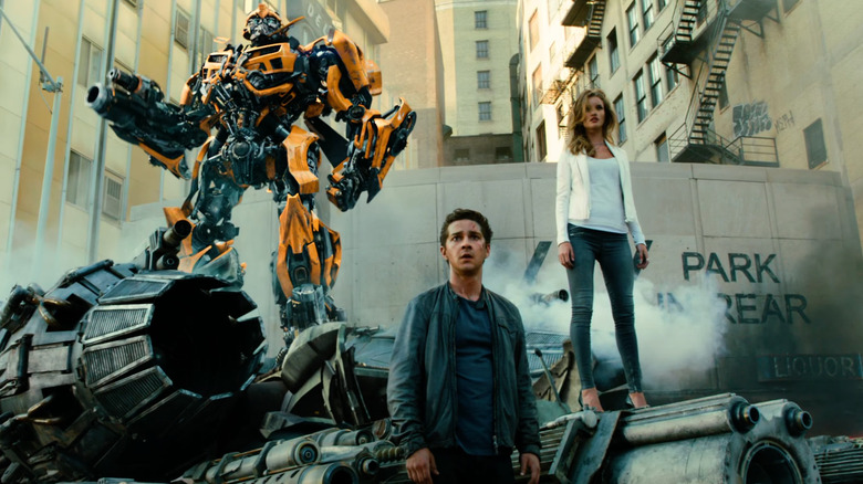 Bumblebee, Sam, and Carly in a city