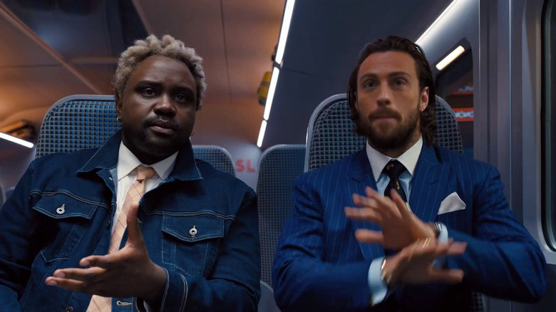 Brian Tyree Henry and Aaron Taylor-Johnson sitting