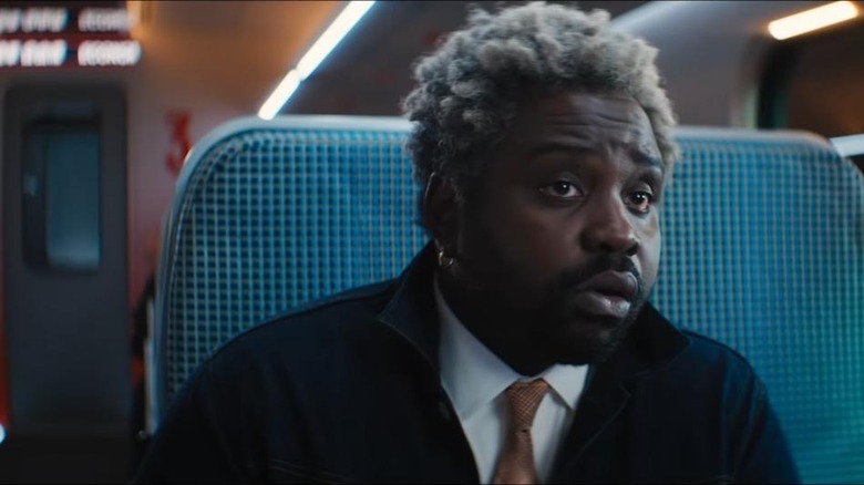 Brian Tyree Henry sitting on train