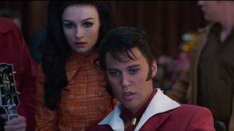 Austin Butler as Elvis and Olivia DeJonge as Priscilla Presley on film set