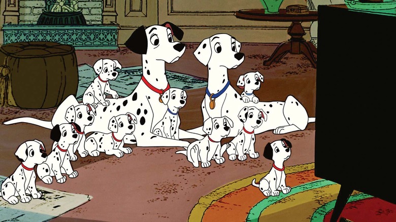 Family of dalmatians watching television