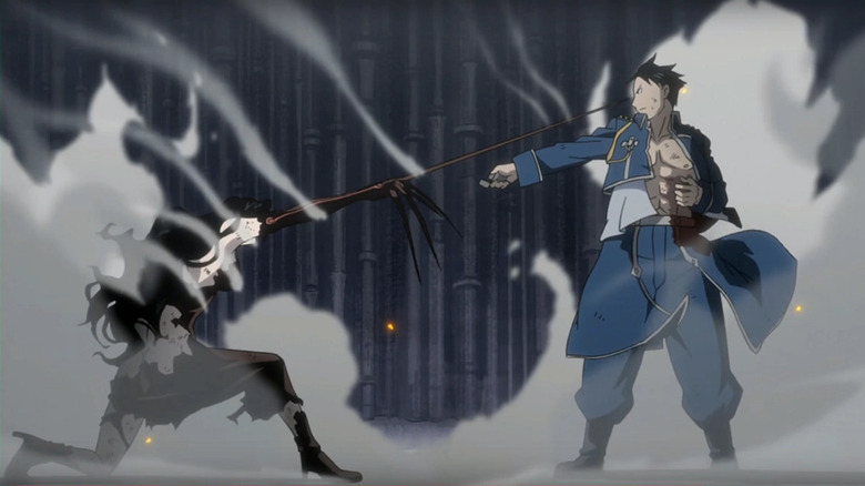 Lust is on one knee trying to attack Mustang, who is about to kill her, in Fullmetal Alchemist Brotherhood