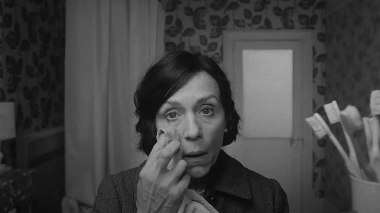 Frances McDormand wipes face in "The French Dispatch"
