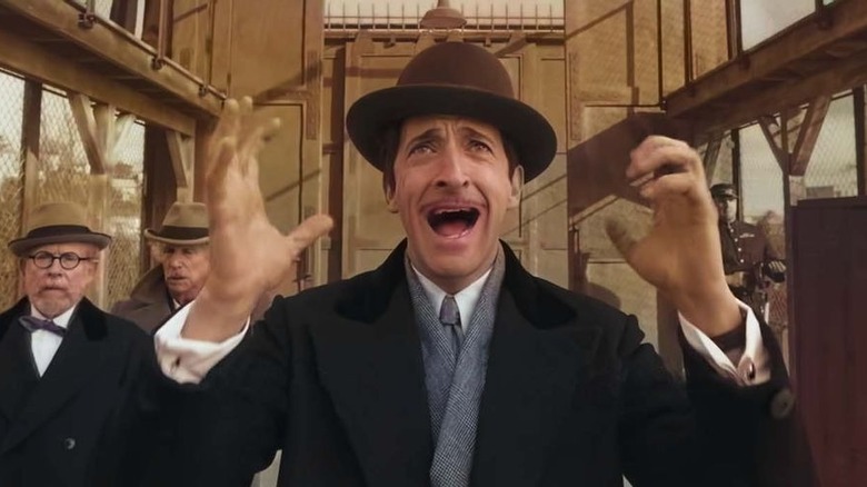 Adrien Brody yells in "The French Dispatch"