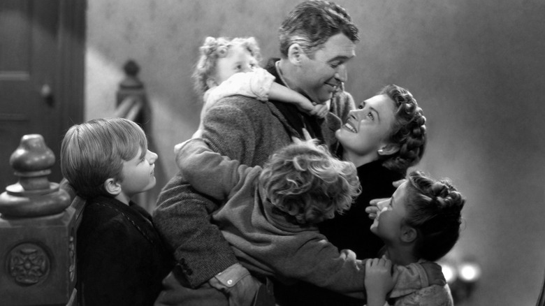 George Bailey hugging Mary and his children in It's a Wonderful Life