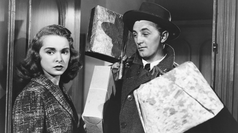 Leigh with Mitchum carrying presents