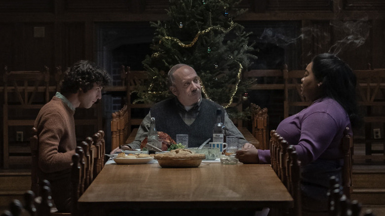 Paul Hunham and Angus Tully look at Mary Lamb during a holiday dinner at Barton Academy in The Holdovers