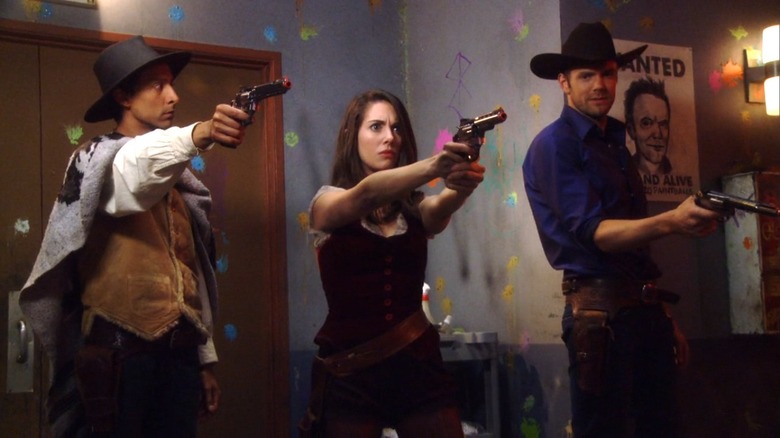 Danny Pudi, Alison Brie, and Joel McHale play paintball