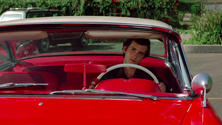 Keith Gordon sits behind the wheel of the murderous car in Christine