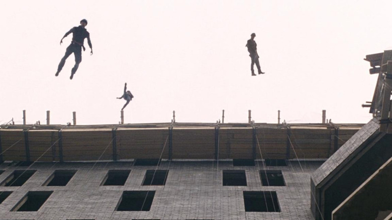 Construction workers jump off a building in The Happening