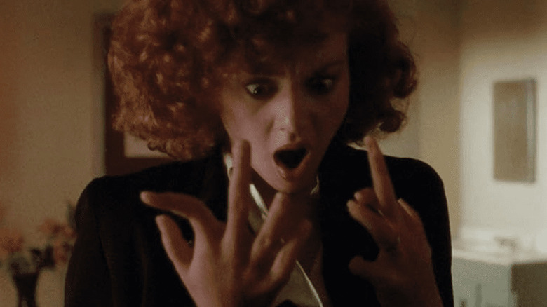 Kim looks at her weird fingers in Silent Night, Deadly Night 4: Initiation