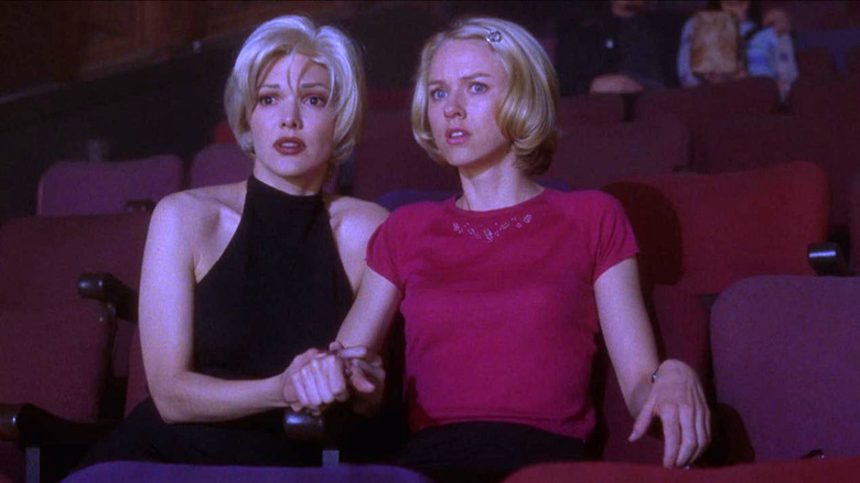 Rita and Betty look alarmed in a theater audience in Mulholland Drive