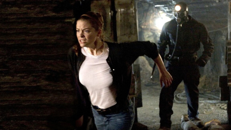 Sarah runs from "Harry Warden" in My Bloody Valentine 3D