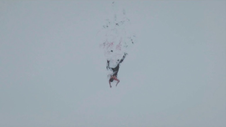 A bloody person crawling through the snow in Climax