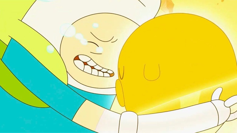 Finn and Jake hug in Adventure Time Distant Lands