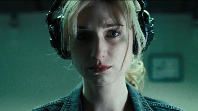 Widows' Elizabeth Debicki wearing headphones