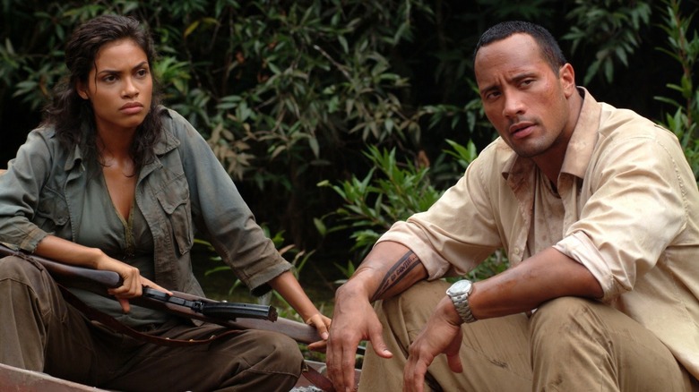 Rosario Dawson and Dwayne Johnson sitting The Rundown