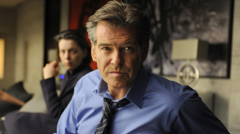 Pierce Brosnan sitting in The Ghost Writer