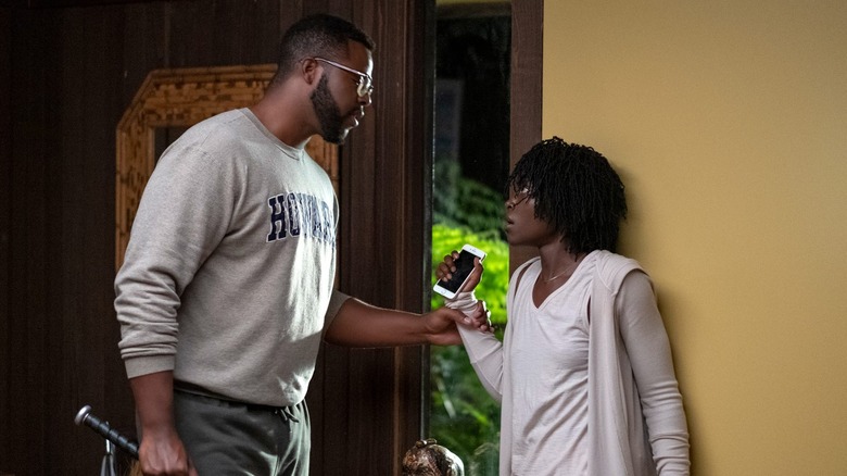 Lupita Nyong'o Winston Duke baseball bat Us