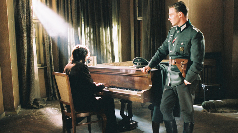 Władysław Szpilman playing piano for a German officer