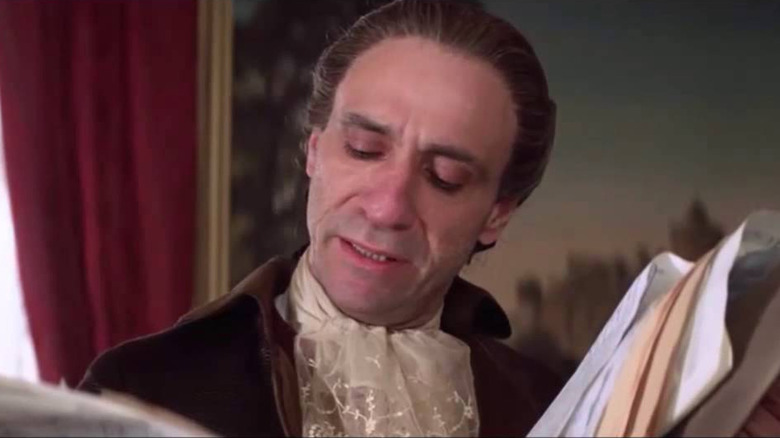 Salieri looks at Mozart's sheet music in Amadeus