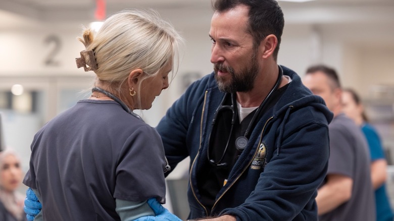 Noah Wyle's Dr. Robby examines Katherine LaNasa's Dana in The Pitt