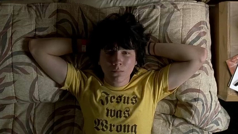 Paul Dano laying in bed looking up