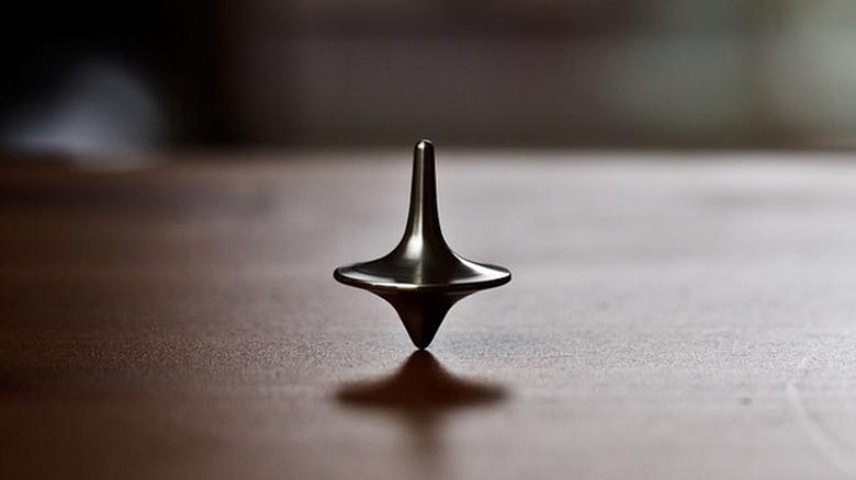 A close up of Cobb's spinning top