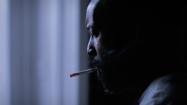 Charles Ouda smoking "Exposure 36"