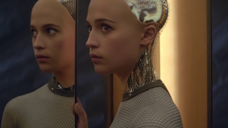 Alicia Vikander standing by mirror