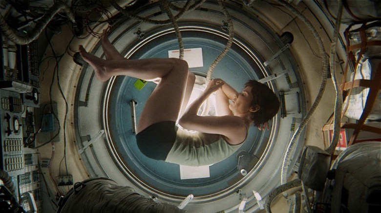 Sandra Bullock floating in fetal position