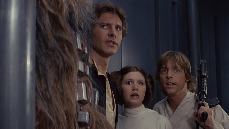 Han Solo, Princess Leia, and Luke Skywalker hiding