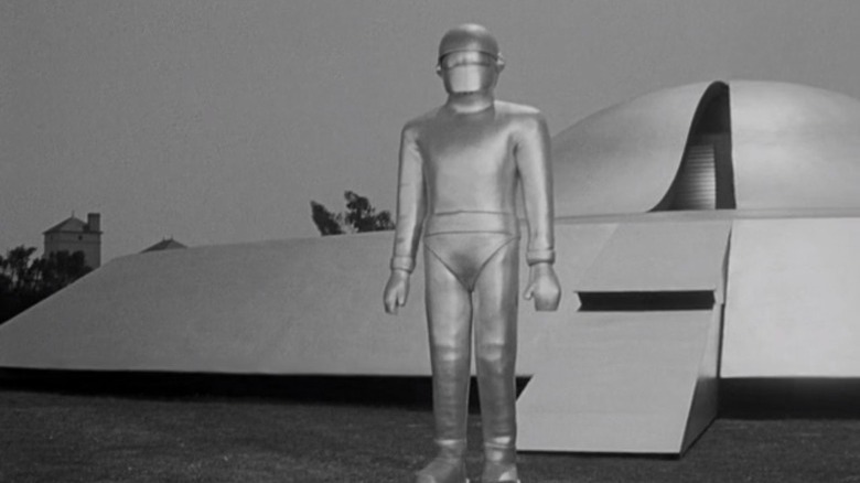 Gort the robot standing by UFO