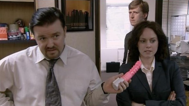 David Brent holding a dildo in The Office