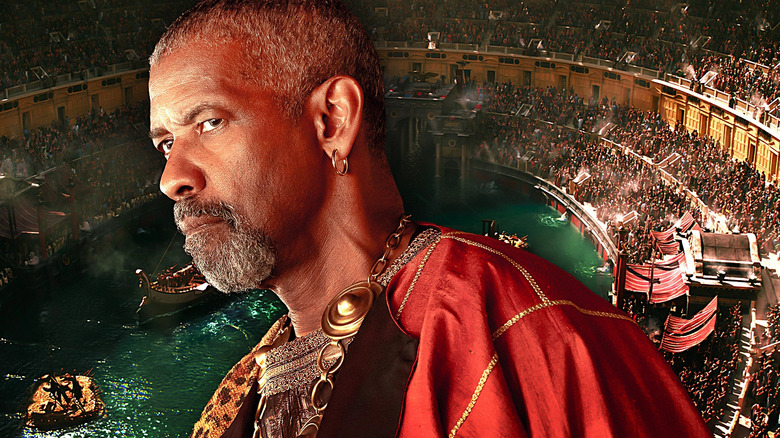 Denzel Washington as Macrinus looking annoyed over the coliseum in Gladiator II