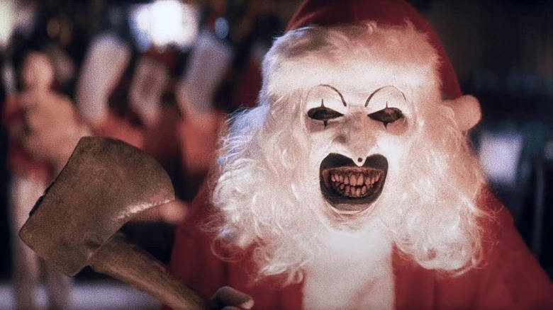 Art the Clown in a Santa suit with an axe, from Terrifier 3.