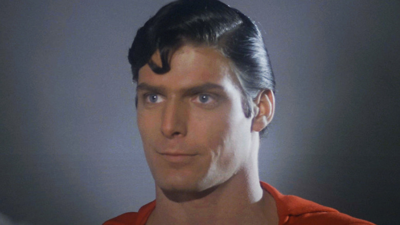 Christopher Reeve's Superman stands against a plain background in Superman