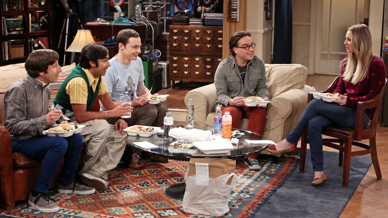 Howard Raj Sheldon Leonard and Penny eating in the living room on The Big Bang Theory