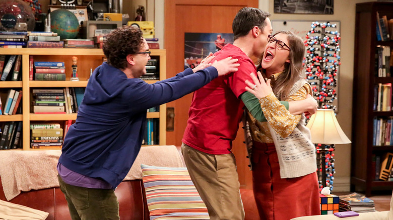 Leonard hugging Sheldon and Amy on The Big Bang Theory