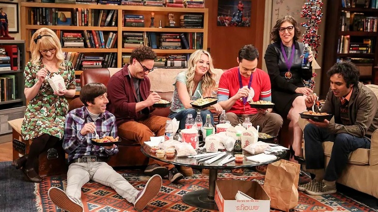 The Big Bang Theory gang having a meal together in their apartment