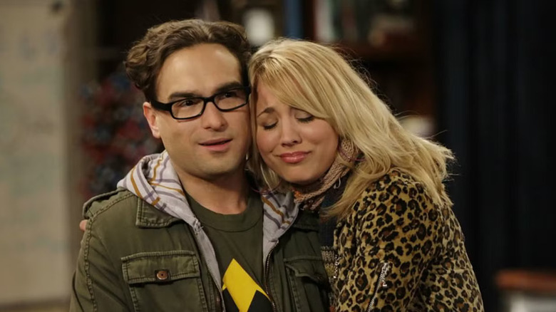 Leonard looking skeptical and Penny hugging Leonard on The Big Bang Theory