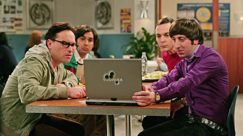 Leonard Raj Sheldon and Howard looking at a computer on The Big Bang Theory