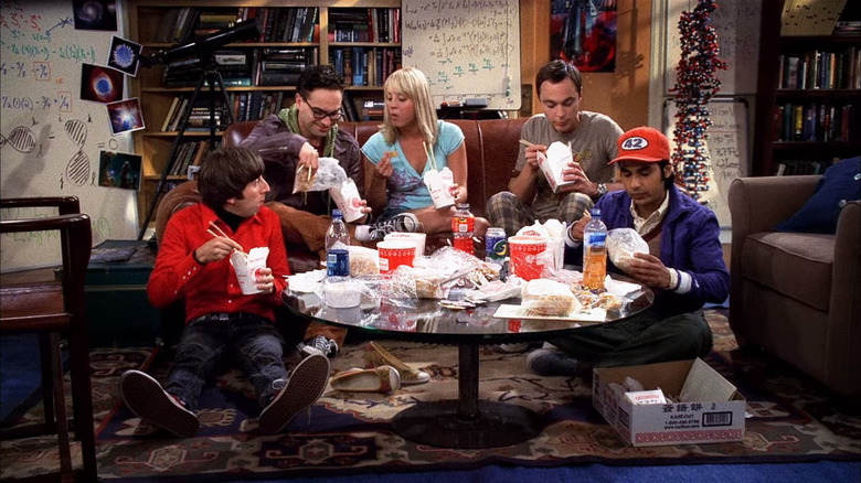 Big Bang Theory cast eating on couch