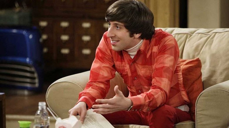 Howard leaning forward on couch Big Bang Theory