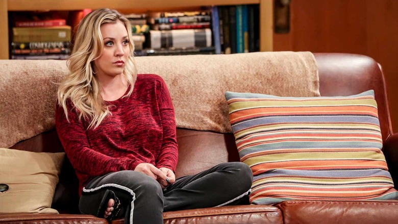 Penny sitting on a couch on The Big Bang Theory