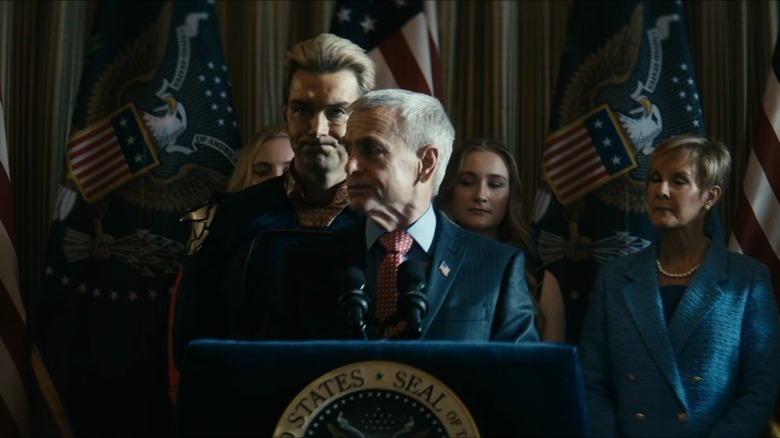 Homelander standing behind President Calhoun after speech in The Boys season 4