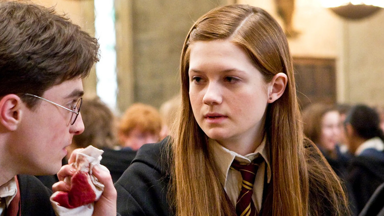 Ginny wiping blood from Harry's face in Harry Potter and the Half-Blood Prince