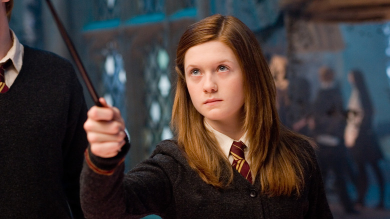 Ginny holding her wand up to cast a spell in Harry Potter and the Order of the Phoenix